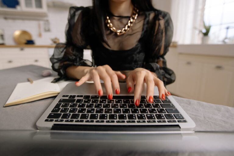 Woman typing laptop