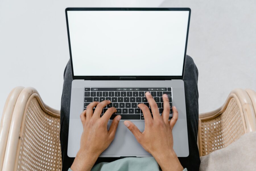Person typing laptop