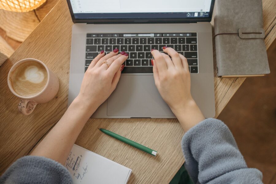 Person typing laptop