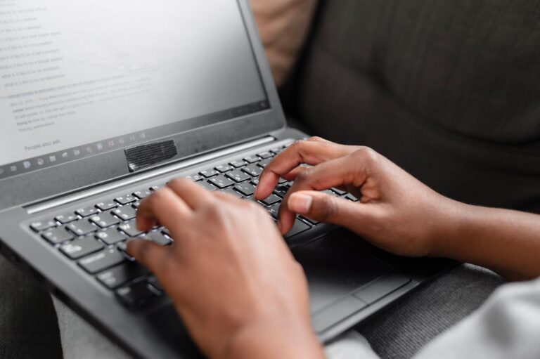 Person typing laptop