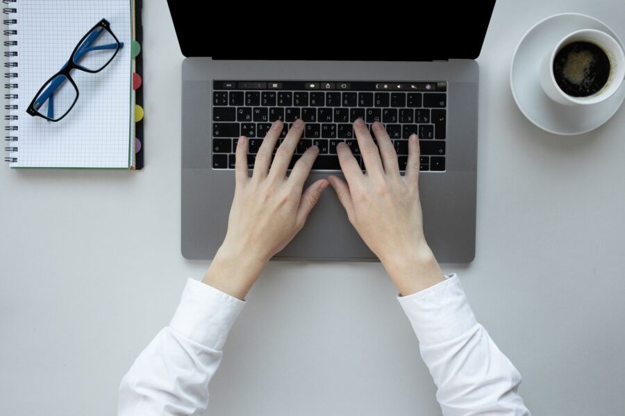 Person typing laptop