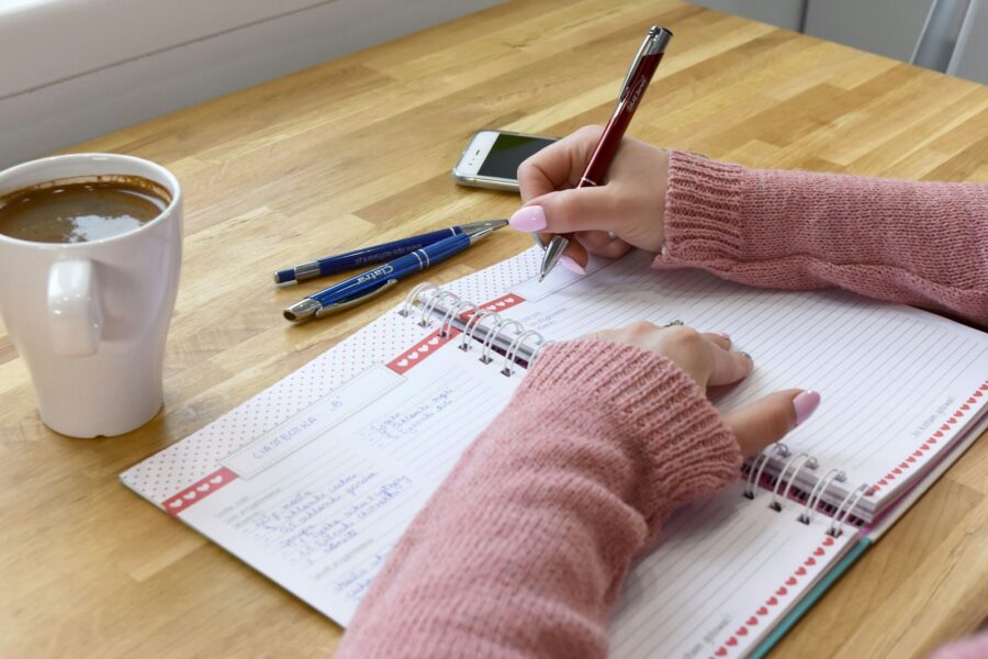 Person writing laptop