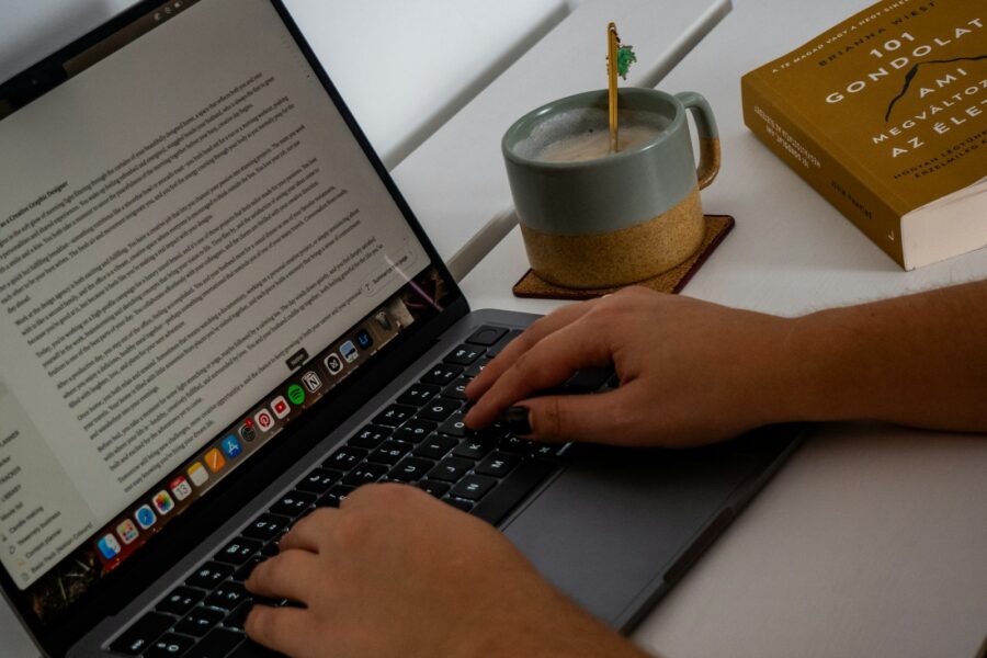 Person typing laptop