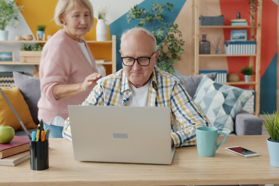 Senior using laptop