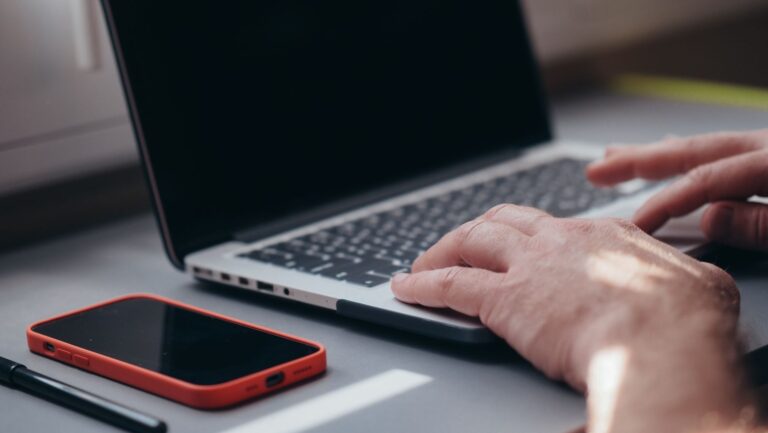 Person typing notes